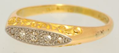 An 18ct gold and five stone diamond ring, size P