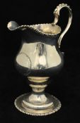 Tall silver cream jug with scroll handle, and gadrooned edge, indistinct hallmarks, 15cm tall,