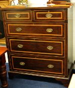An Edwardian dark mahogany and cross banded chest fitted with two short and three long drawers,