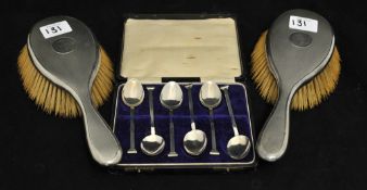 A set of six silver tea spoons 38g, in fitted case together with a pair of silver back brushes