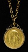 An Edward VII gold 1908 sovereign in 9ct gold mount on fine chain