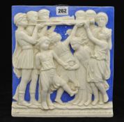 19th century ceramic wall plaque with relief decoration of children trumpeters and dancers 30cm x