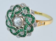 A fine emerald and diamond ring, size O