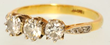 Three stone diamond ring set with three old cut diamonds approx.75 carat indistinctly hallmarked,