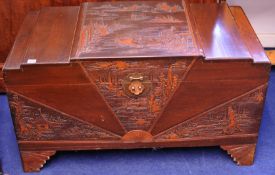 A carved wood Chinese blanket chest 59cm high, 101cm wide
