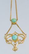 An Art Nouveau turquoise and pearl pendant set in 15ct gold, with a fine chain