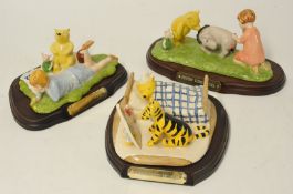 Royal Doulton Winnie The Pooh Limited Edition Collectables including WP15, WP21, and WP22 on wood