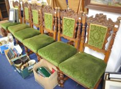Set of six late Victorian carved oak dining chairs with over stuffed seats.