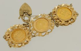 Bracelet containing five gold half sovereigns within an ornate yellow metal bracelet the padlock