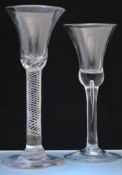 An 18th century air twist wine glass, 18cm (repaired) and another wine glass.