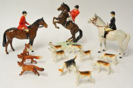 A Beswick hunt group comprising a huntsman on a standing bay horse, no. 1501, gloss finish, 21 cm