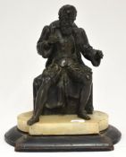 Bronze figure of a seated man on alabaster and wood plinth, 24cm high.