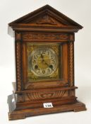 Late Victorian carved wood cased mantle clock, 37cm high with key and pendulum, movement stamped