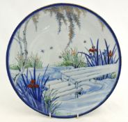 Oriental earthen ware wall plate, 31cm.