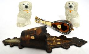 Small tortoiseshell mandolin, miniature Staff encrusted poodles, lacquered wall mounted match