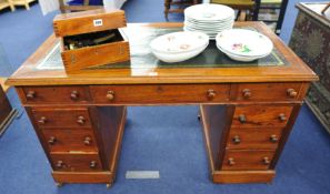 An Edwardian mahogany pedestal desk fitted with nine drawers, 120cm wide.