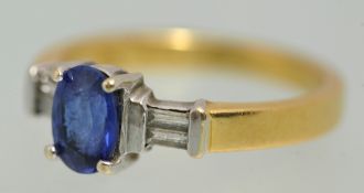18ct ring set with baguette cut diamonds and central sapphire, size, N.