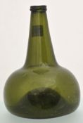 Antique pale green glass onion wine bottle, possibly Dutch, 27cm high.