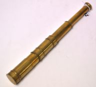 A brass three pull pocket telescope with cover, 43cm extended.