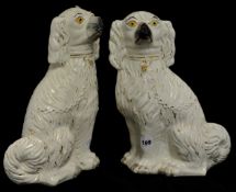 Pair of Victorian white Staffordshire dogs, 34cm.