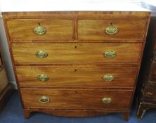 Early Victorian mahogany chest fitted with two short and three long drawers on swept bracket feet,