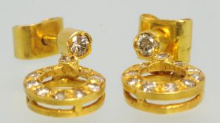 Pair of 18ct yellow gold round earrings set with diamonds.