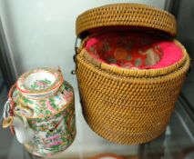Oriental Cantonese porcelain teapot with wicker basket, 12cm high.