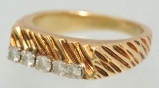 9ct gold ring set with five diamonds, size L.
