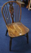 19th century single Windsor chair with yew hooped back, elm seat and crinoline stretcher.
