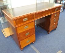 Victorian mahogany pedestal desk with recess brass military handles in three sections,126cm wide and