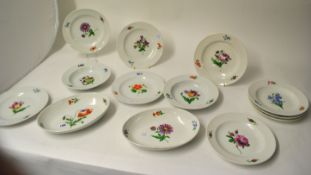 Collection of 19th century hand painted flower plates and dishes with crossed blue swords under