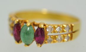 Unmarked yellow gold ring set with diamonds and three gemstones, possibly 18ct, size, K.