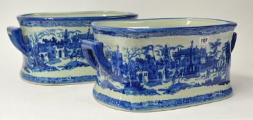 A pair of reproduction blue and white foot baths, 20cm high.