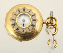 Gold Ladies half hunter fob watch stamped 14k with key.