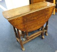 Small oak sectional `Owl` bookcase t/w early 19th century drop flap table with turned legs.