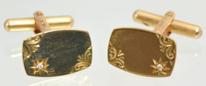 A pair of 9ct gold cufflinks engraved and each set with a diamond approximately 4.7g