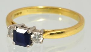 Modern 18ct three stone ring set with central sapphire and two round cut diamonds in original Martin