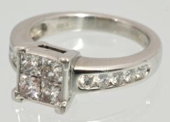 An 18ct white gold ring set with princess and round cut diamonds approximately 1 carat, Size L