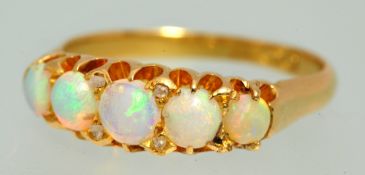 18ct gold ring set with five graduated opals, size P,