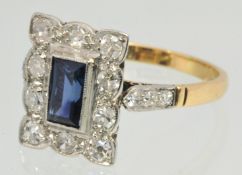 18ct diamond and sapphire ring of square form with central baguette cut sapphire, Size, N