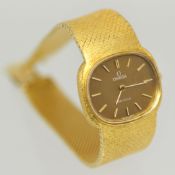 Ladies 18ct yellow gold oval Omega De Ville manual wristwatch, champagne dial with batons on bark