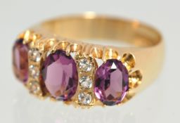 A large 9ct gold ring set with amethyst and diamonds, size N