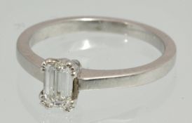 A diamond solitaire ring set in platinum with single baguette cut diamond approximately .30 carat