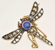 A dragonfly brooch in silver gilt set with diamonds, rubies and single blue sapphire and further