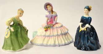 Three Royal Doulton figures HN 1731`Daydreams`, and HN 2211 and HN 2341