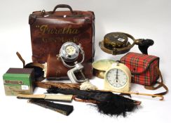 Various objects including Gas Mask suitcase, parasols, View Master stereoscope, a binnacle