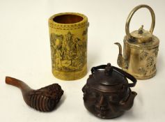 Various reproduction objects including brush pot, white metal teapot, wood carving and bronze effect