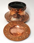 An Art Nouveau copper jardinière and embossed dish, 29cm diameter
