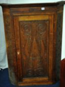 19th century carved oak hanging corner cupboard with single door approximately 117cm high