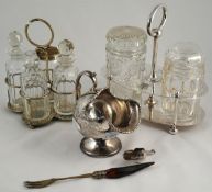 A two jar and silver plated pickle stand, silver plated sugar helmet and four bottle cruet